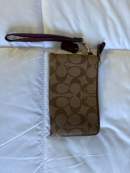 Coach Handbags - Coach Brown Signature Canvas Wristlet with Burgundy Strap with Dust Cover